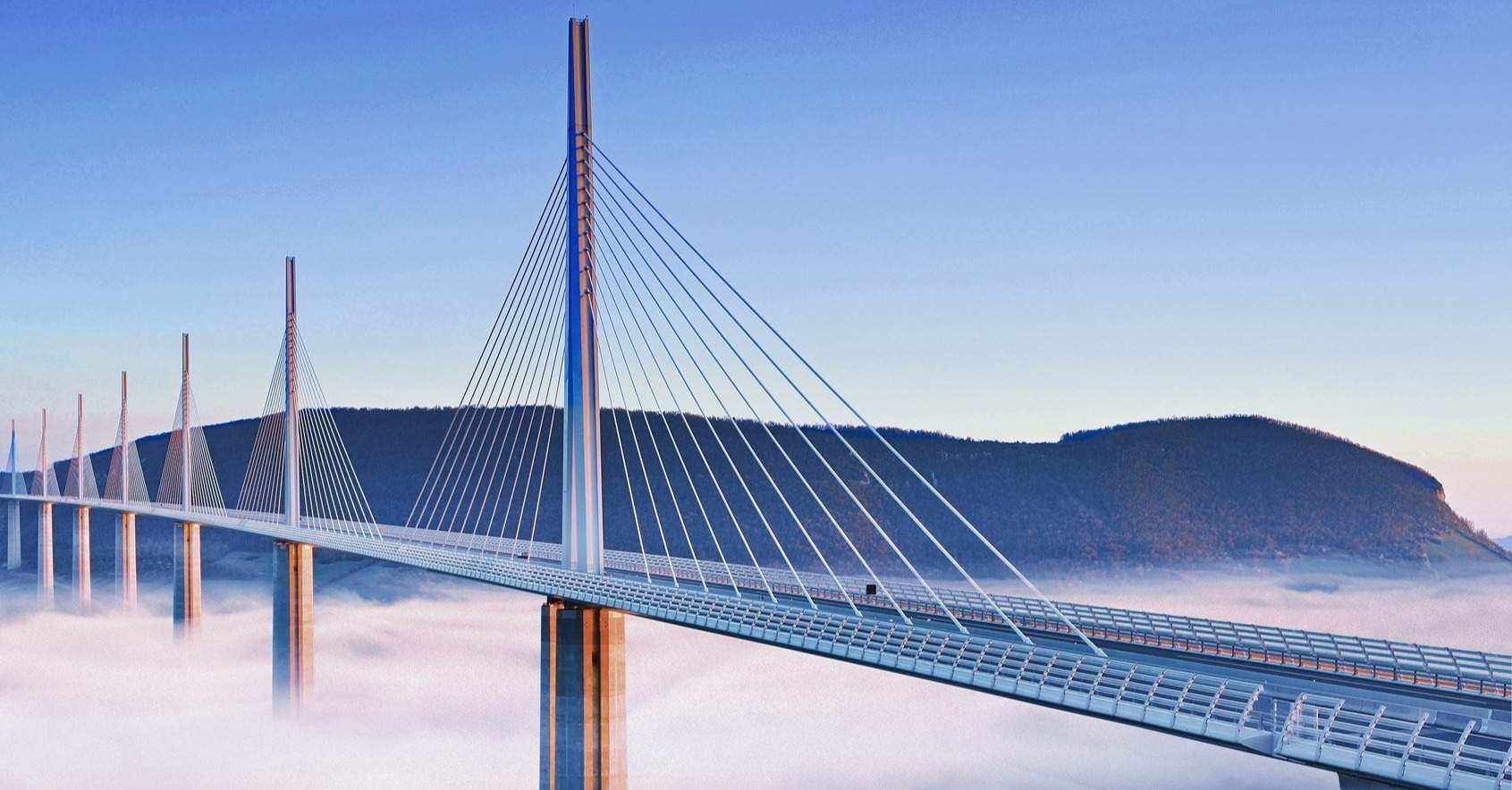 The Millau Viaduct crossing a valley above the clouds